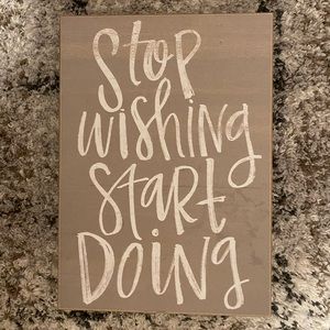 a sign that says “stop wishing start doing”